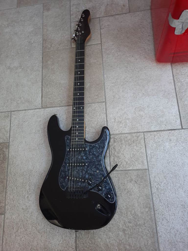 Encore Stratocaster Style Electric Guitar In black.