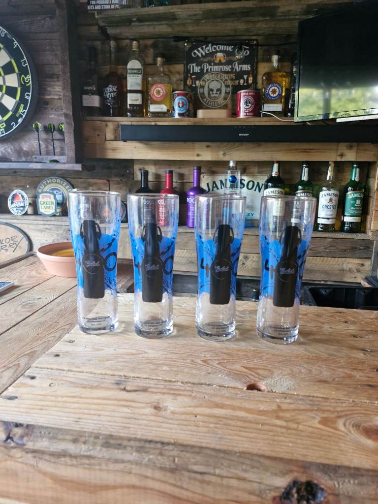 4 brand new grolsch pint glasses 