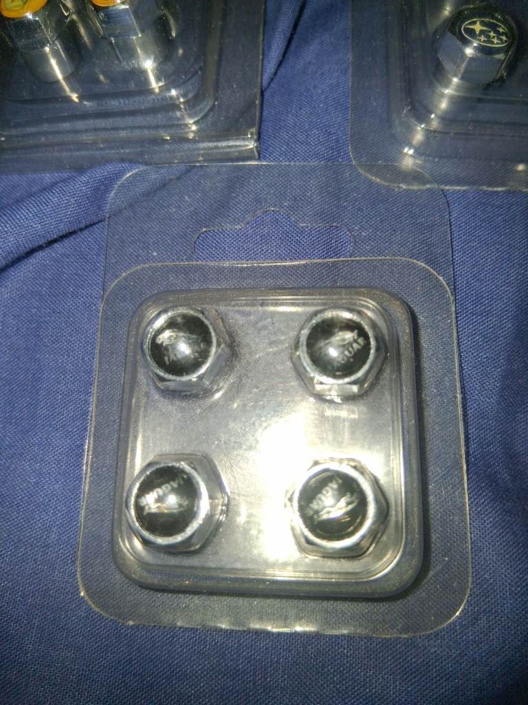 CAR DUST CAPS metal many brands amg jag vw gti ford 