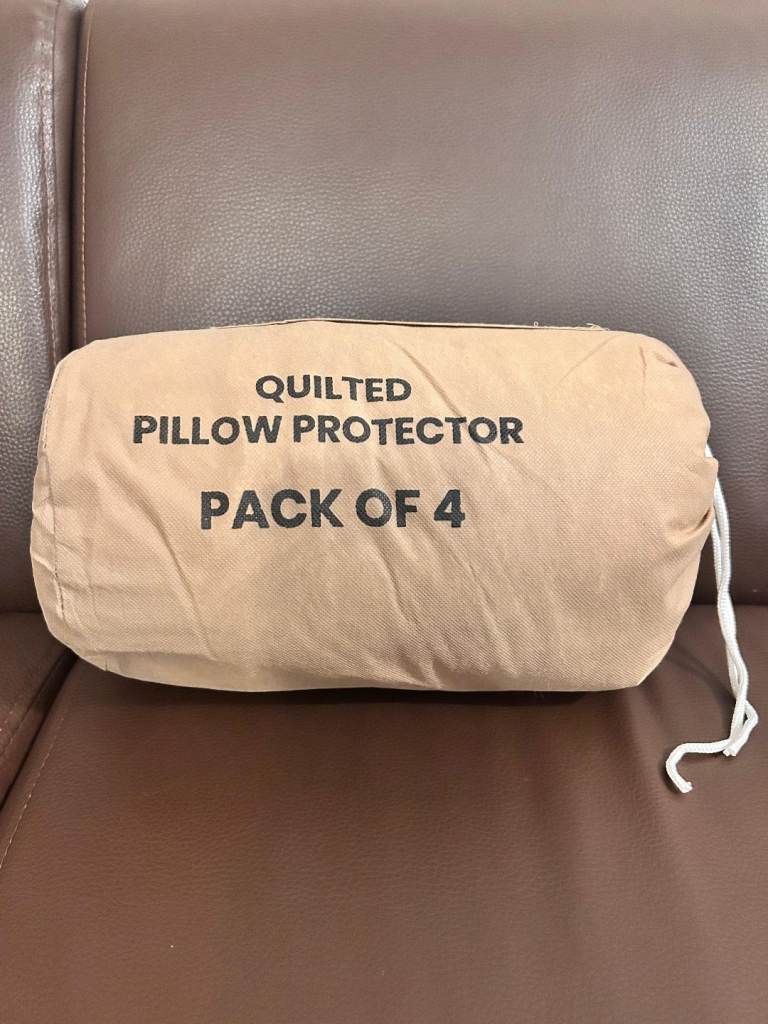 4 Brand New Quilted Zipped White Pillow Protectors - 50 X 75CM .