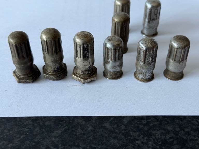 old pre war car tyre  valve caps