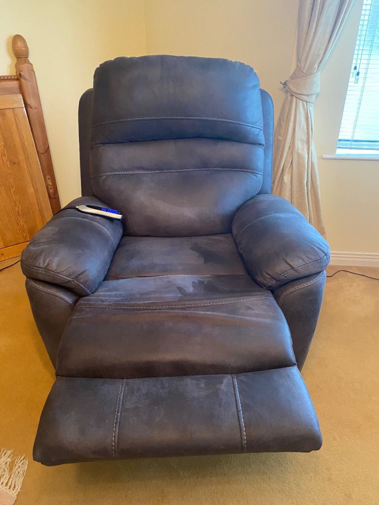 Electric rise and fall armchair in dark grey. 