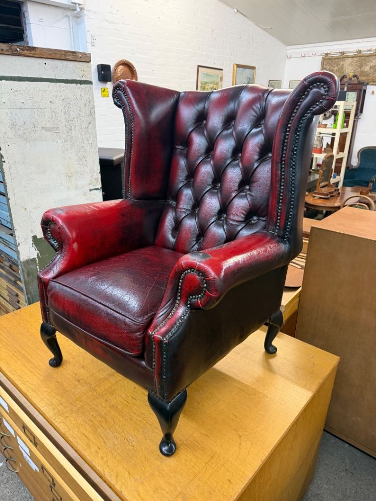 Red wingback chesterfield armchair (damaged arms / hole in arm)!