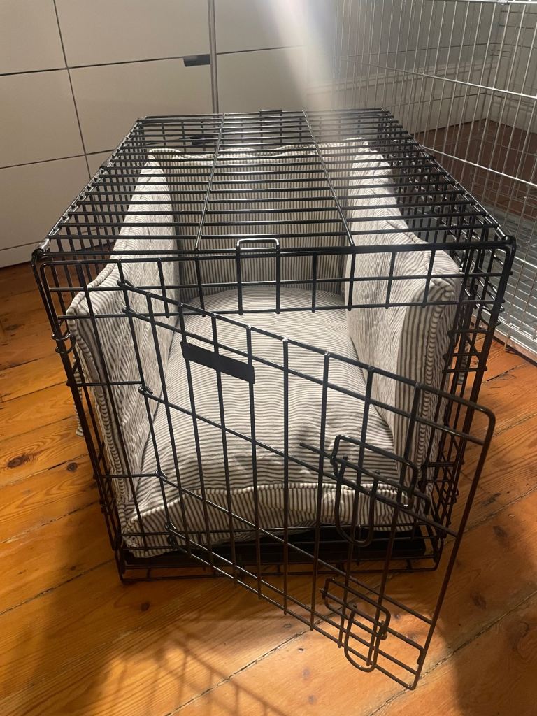 Small dog crate with bedding