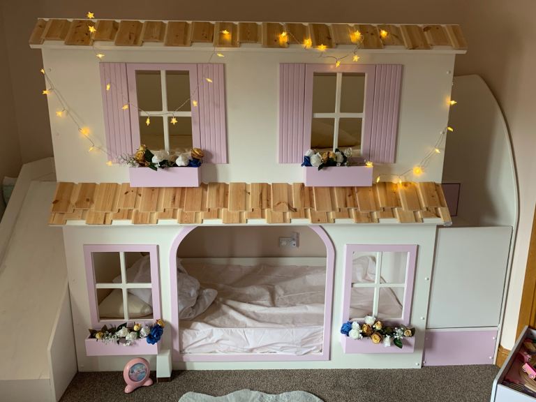 Kids bunk bed full singles with slide and samsung tv mounted inside bottom