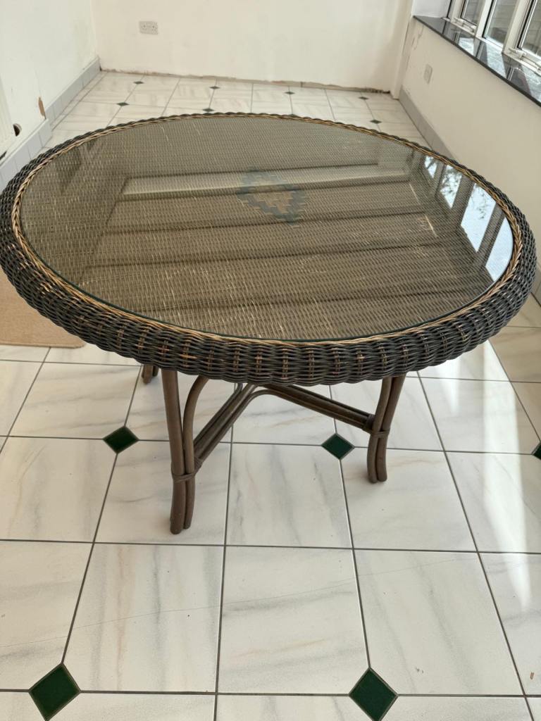 Wicker table, used in conservatory. Vintage and retro. 