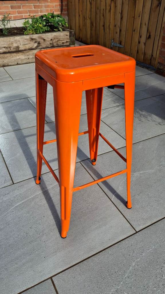 Set of Orange Metal Bar Stools