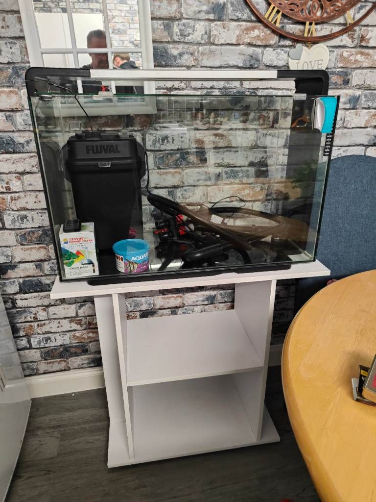 2ft fishtank like new also external filter and some accessories.built in lights