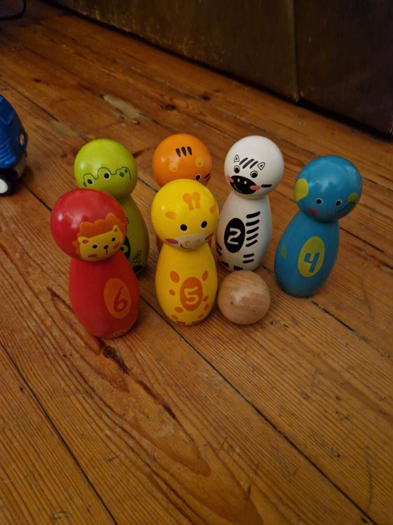 Wooden character skittles (bowling pin set).