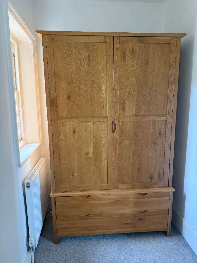Wardrobes, bed, beside table and chest of drawers. Solid oak bedroom furniture set.