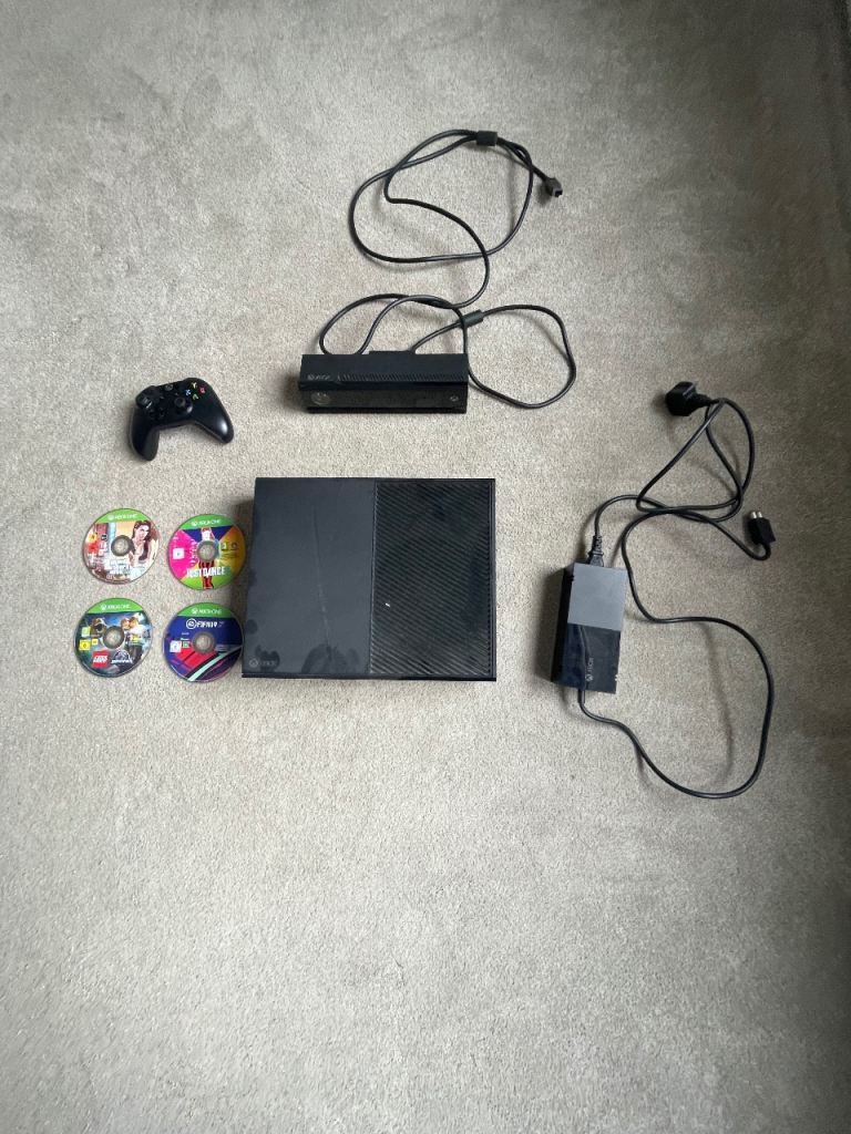 Xbox one with games and camera attachment 