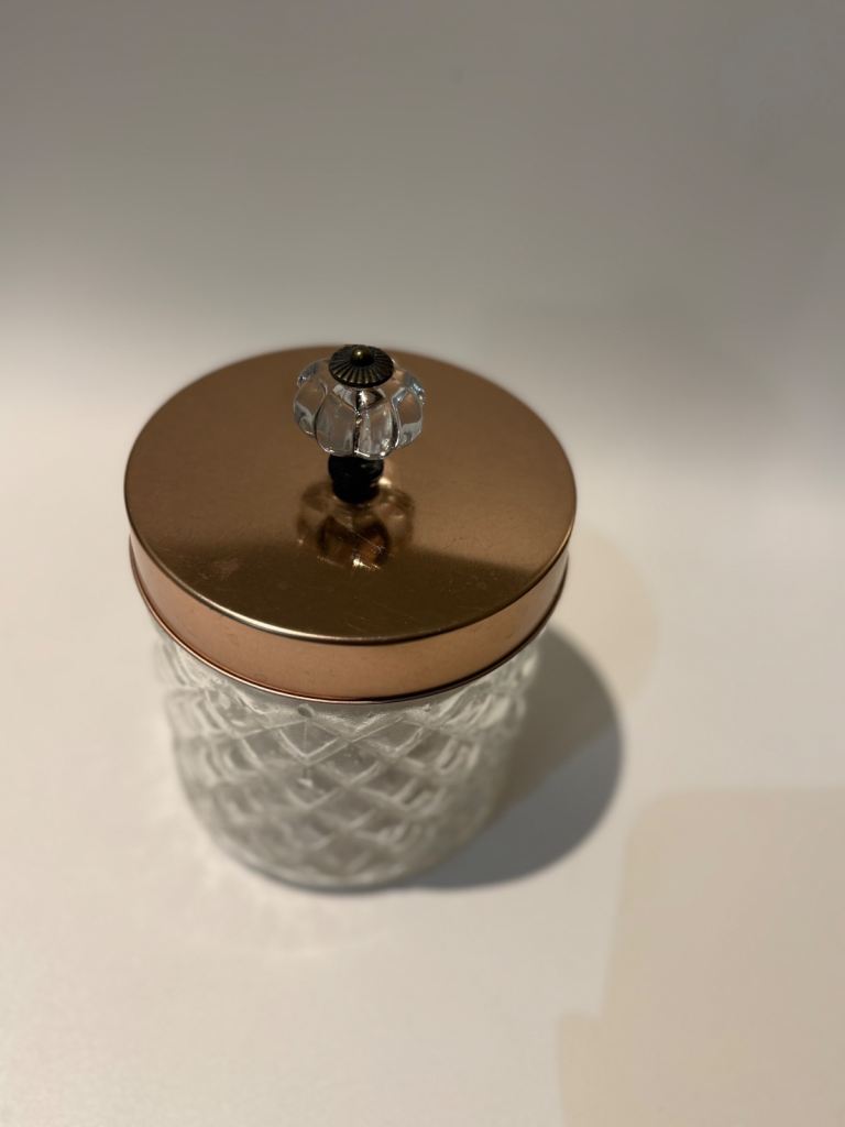 Decorative Glass Storage Jar with Copper-Tone Lid