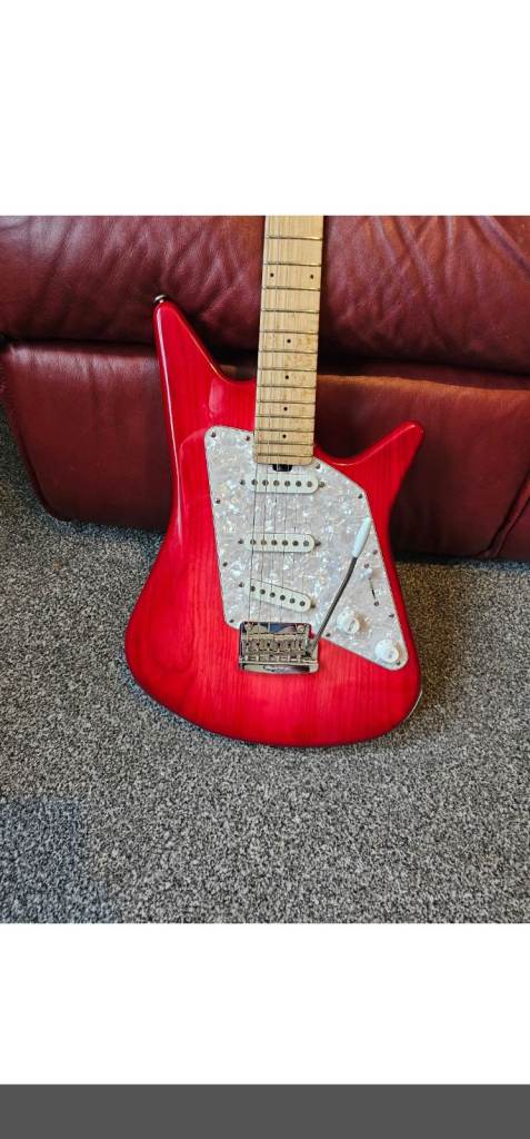 Albert Lee musicman in Pink burst mint played by him