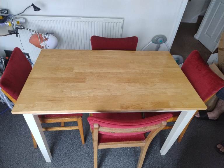 Wooden Dining Table with Four Red Chairs – Good Condition