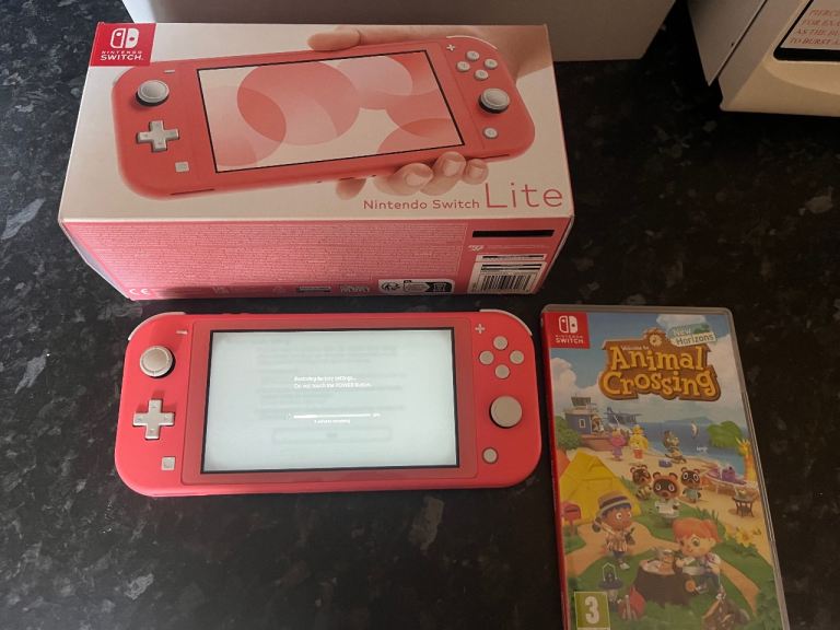Nintendo Switch Lite (Coral) with Animal Crossing