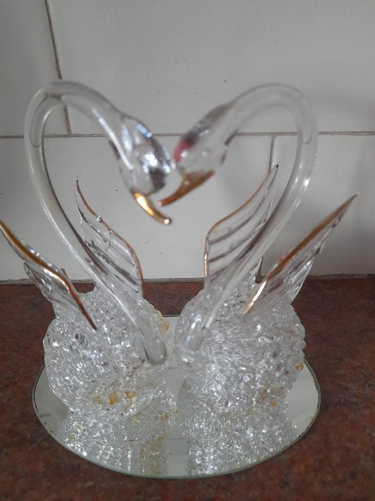 New, beautiful, handmade loving swans in glass. Great for gifting.