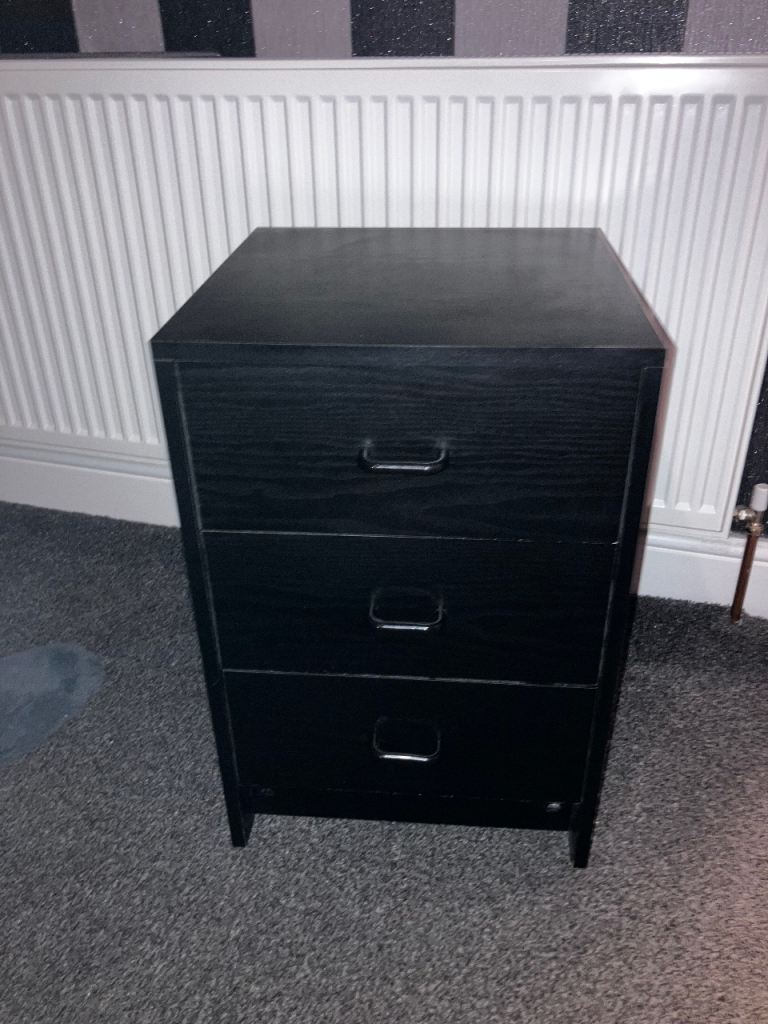 Bedside table in black wood can deliver for a small charge