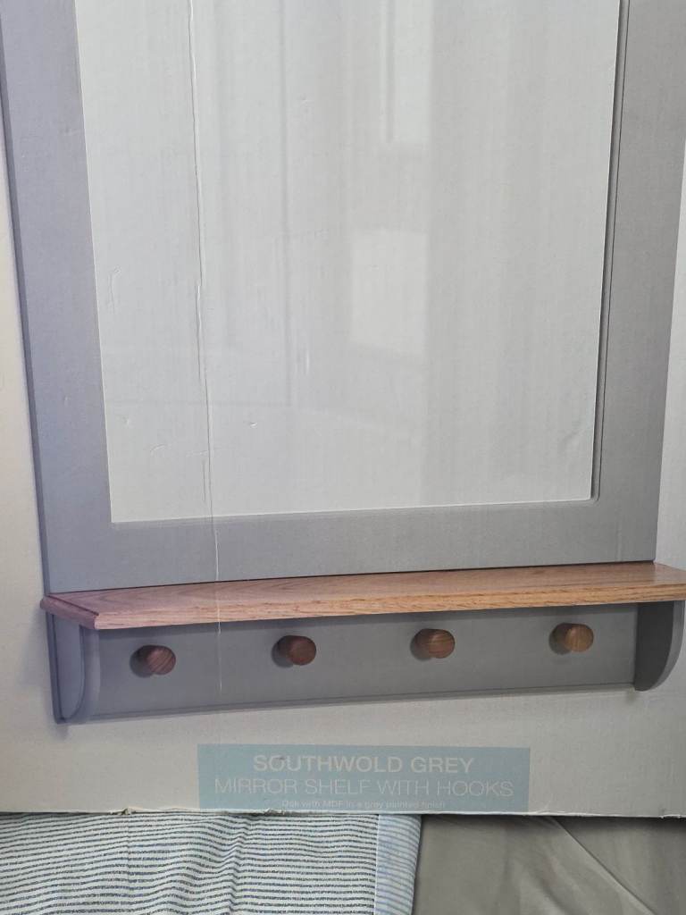 Next mirror with hooks and shelf new in box