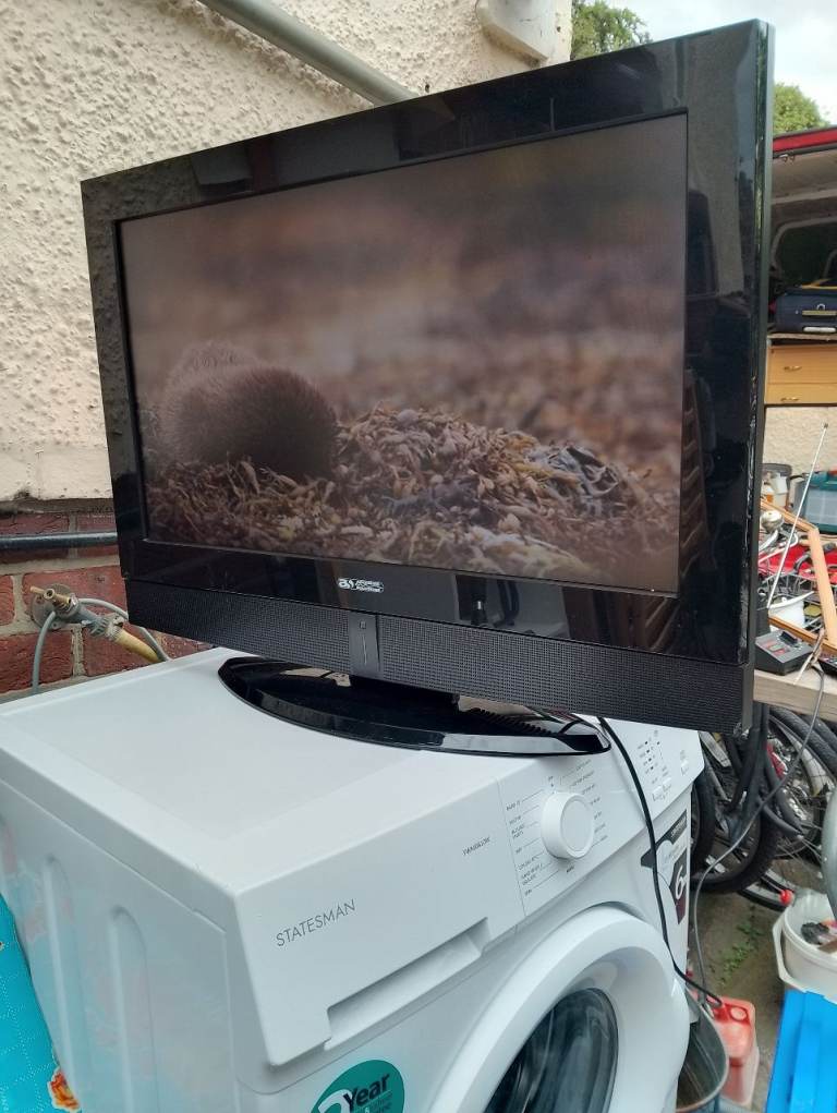 26ins.'ACOUSTIC SOLUTIONS' television with remote in perfect condition allround 