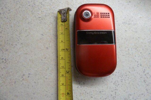red Sony Ericsson Z320i clamshell mobile phone