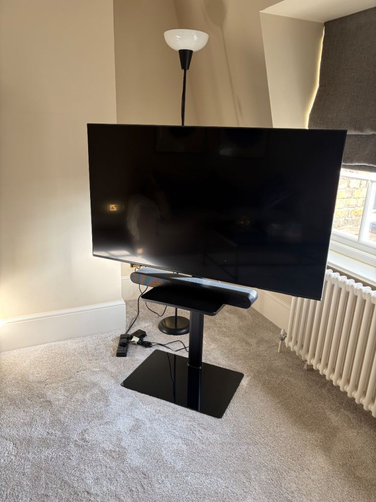 55” Samsung TV with Samsung soundbar and stand
