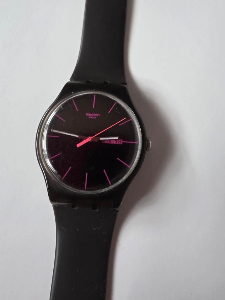 Swatch AG 2010 Black Rebel watch with pink indices and day-date display