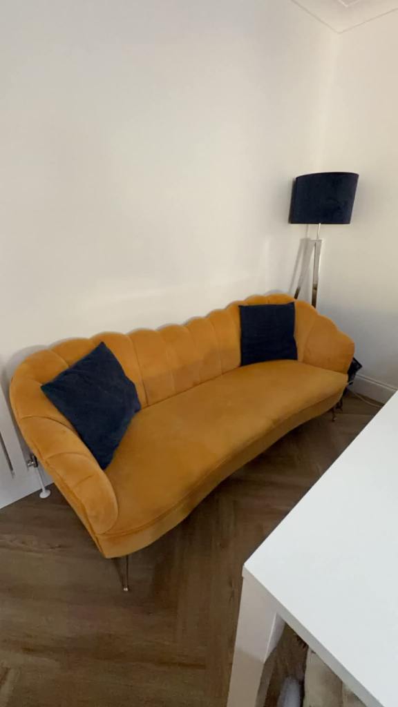 Mustard sofa with scallop design 