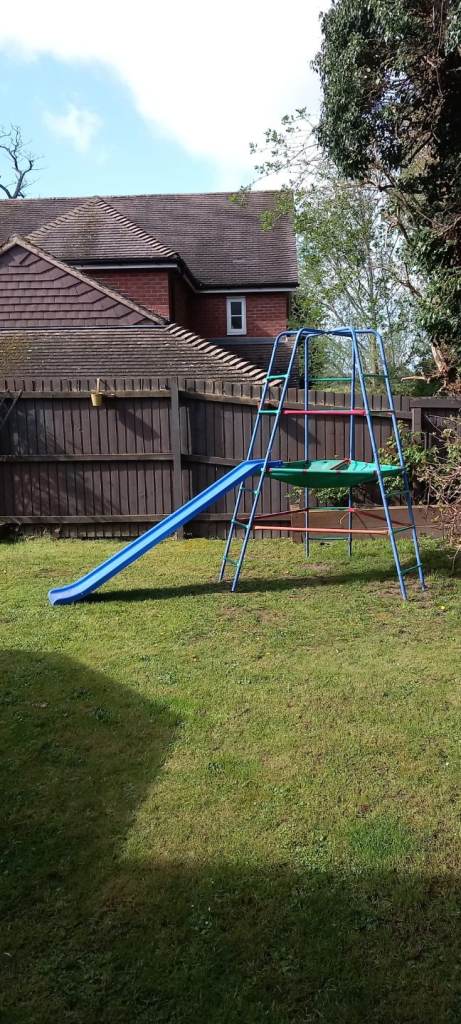 Climbing frame with slide