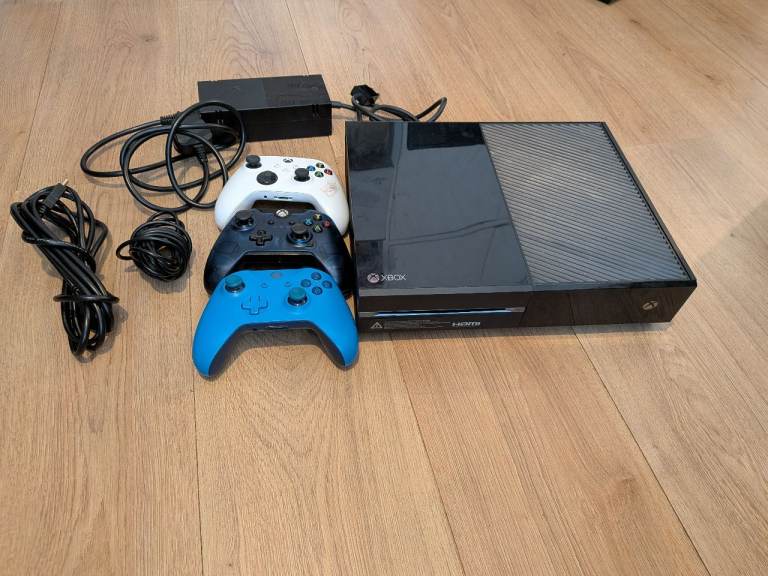 Xbox One Console with Three Controllers and Cables