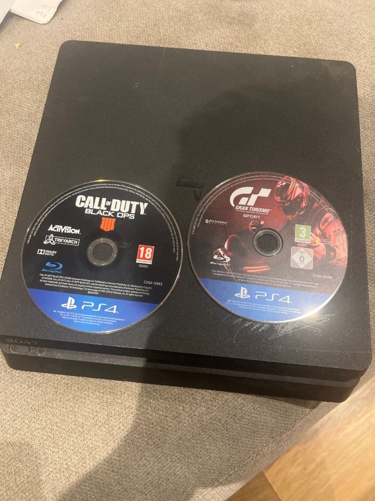 Sony PlayStation 4 (PS4) with Call of Duty and Gran Turismo