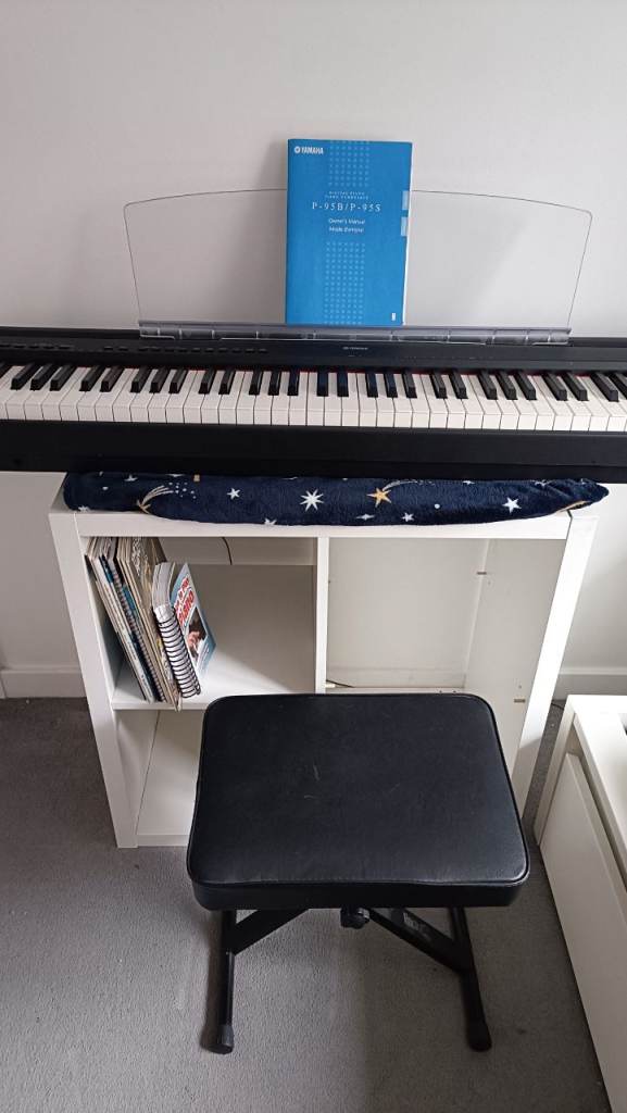 Yamaha P95B piano keyboard, stool and beginners books