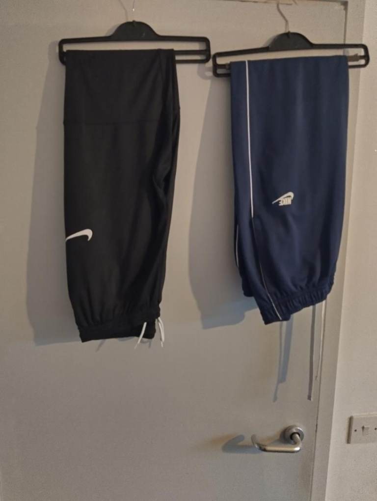 2 brand new nike track bottoms pockets both sized 38w 31 leg 1 black 1 blue 