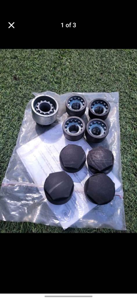 Opel/Vauxhall locking wheel nuts with covers.