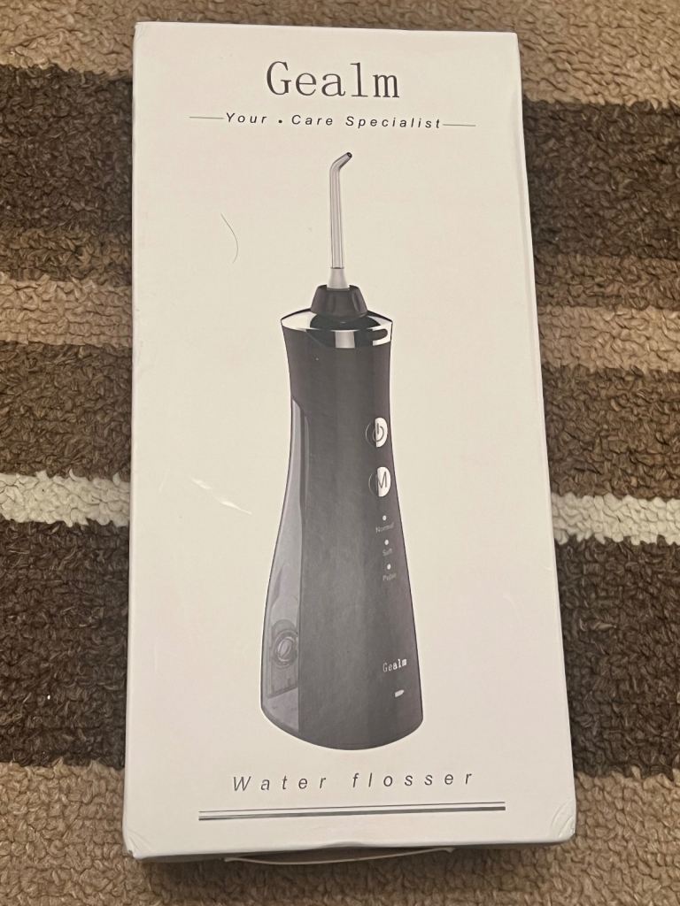 Brand new Gealm portable water flosser, never used and still in original box.