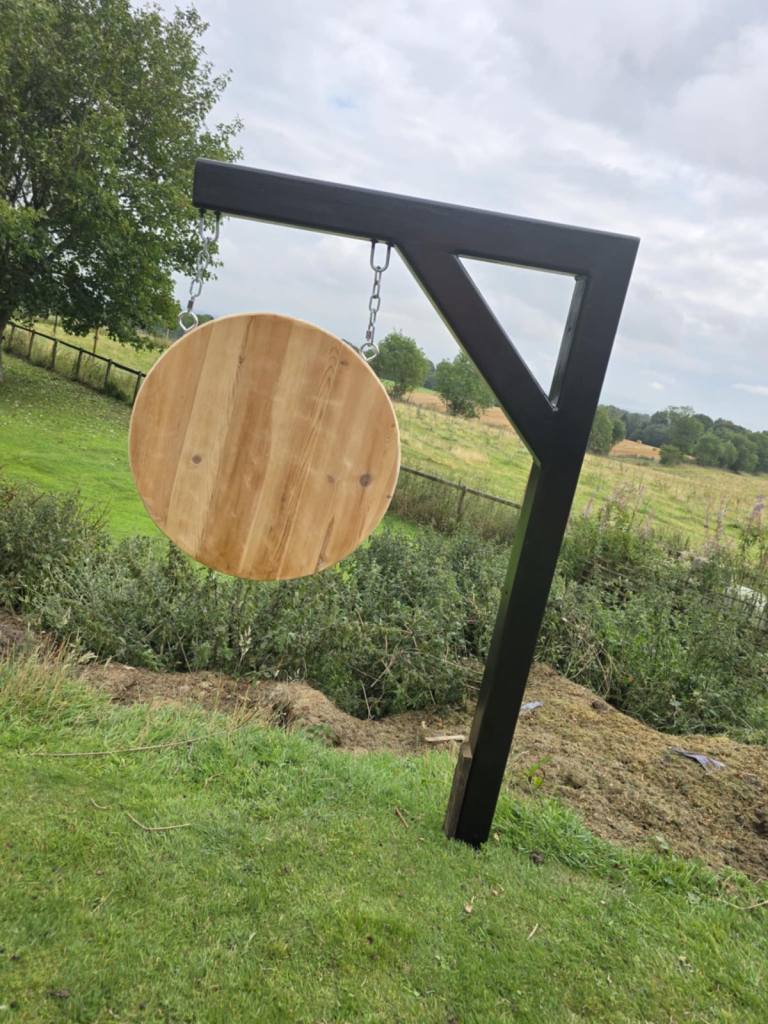 Outdoor name sign with heavy duty metal post 