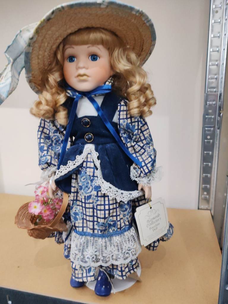 Porcelain doll and basket 