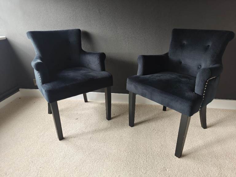 Black velvet accent chairs with silver stud and handle detail (pair)