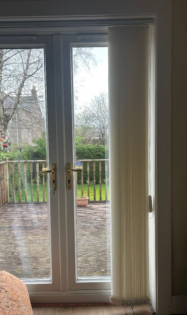 Vertical patio door blinds on track