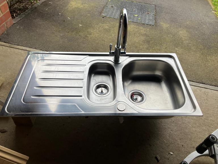 Kitchen sink with tap