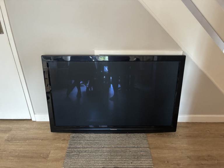 Panasonic 55" TV with stand and remote