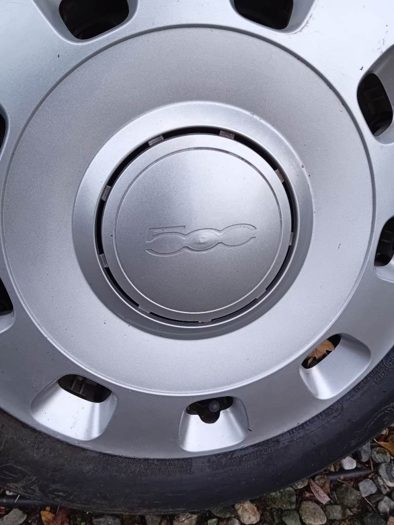 Metal wheels and tyres with genuine fiat wheel trims.