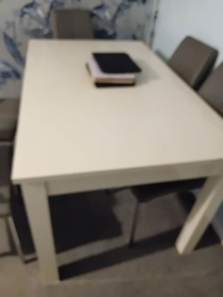 White Dining Table with 4 Grey Chairs – Fair Condition