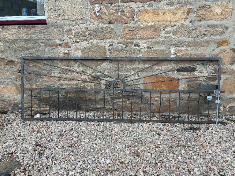 Large metal driveway gate.