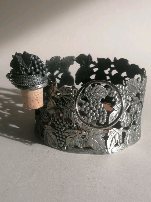 Vine bottle holder with cork. 