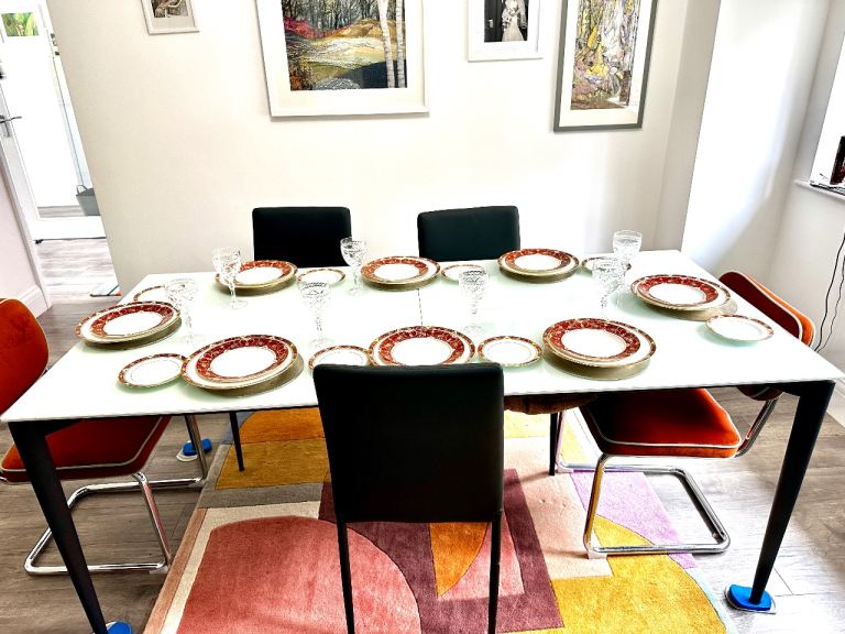 Modern Glass Dining Table with Black Metal Legs – Excellent Condition
