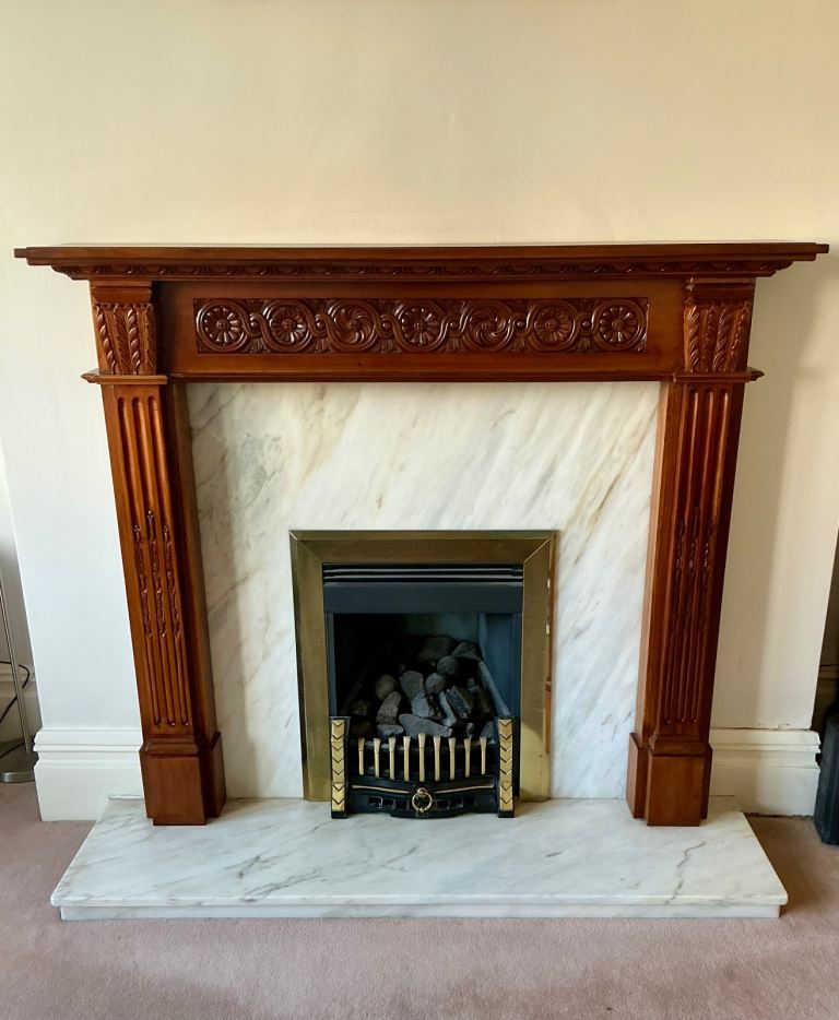 Beautiful Italian marble fireplace and rosewood surround