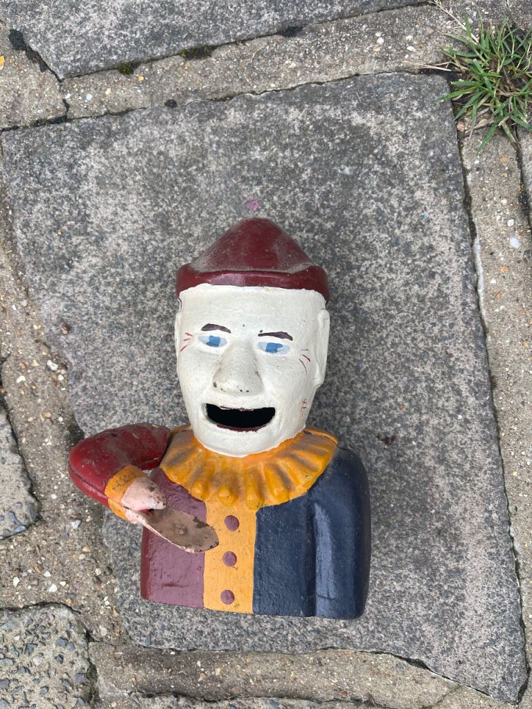 Vintage cast iron mechanical clown money box