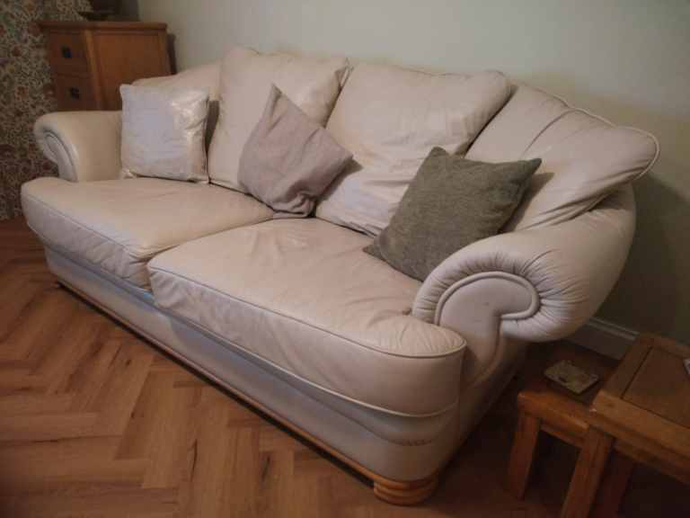 Comfortable two-seater sofa in cream leather