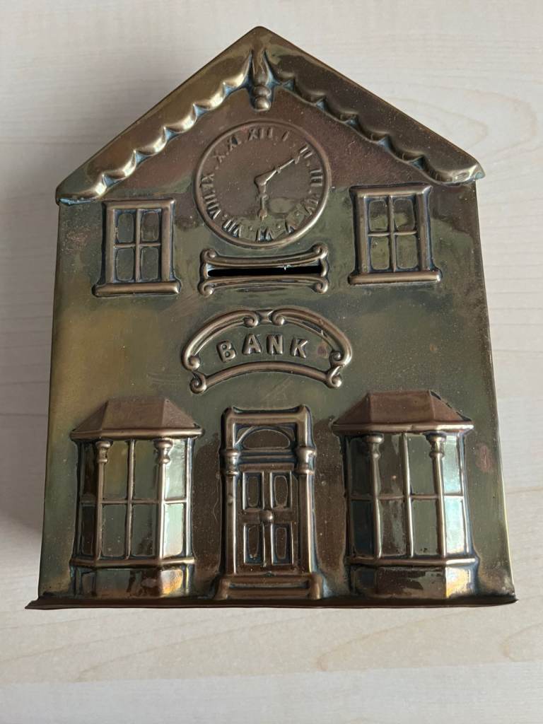 Brass fronted, house shaped vintage money box