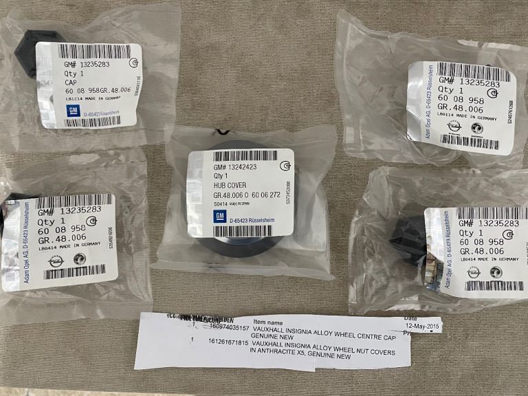 NEW AND UNUSED VAUXHALL INSIGNIA ALLOY WHEEL CENTRE CAP x 1  & ALLOY WHEEL NUT COVERS x 4